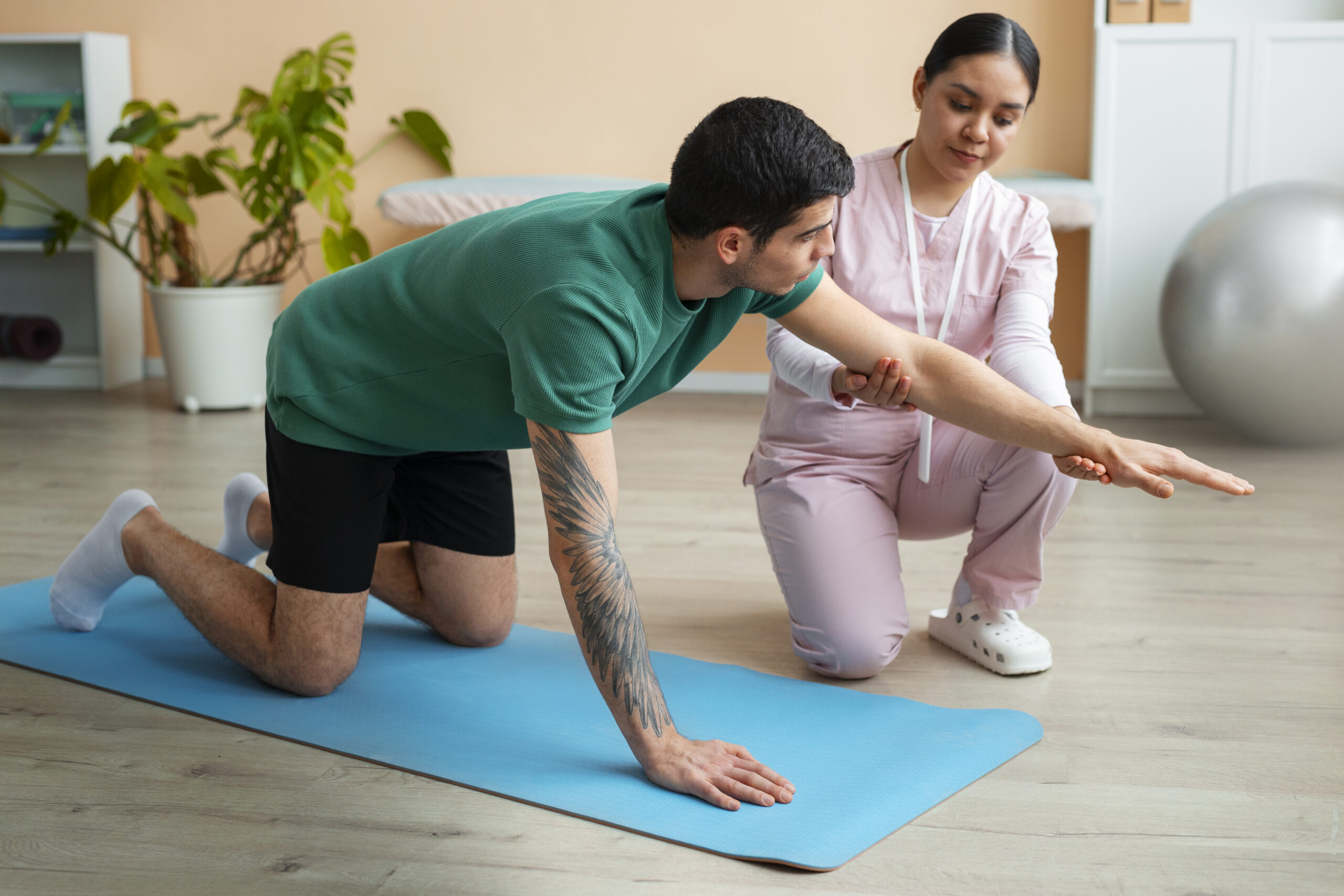 doctor-helping-patient-rehabilitation