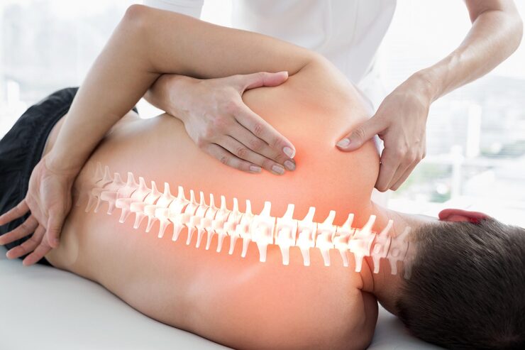 woman-with-back-pain-is-touching-back-her-back_954367-184